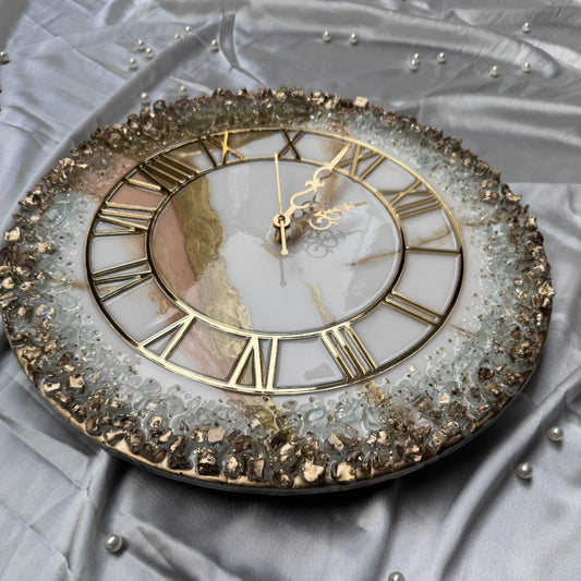 Decorative wall clock with gold Roman numerals on a textured gray background
